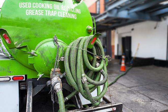 pumping out excess grease and waste from a restaurant's trap in Belleville